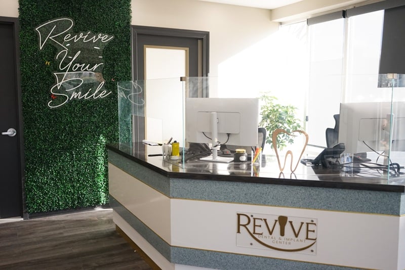 Dental office reception desk with welcoming check-in area and modern interior design
